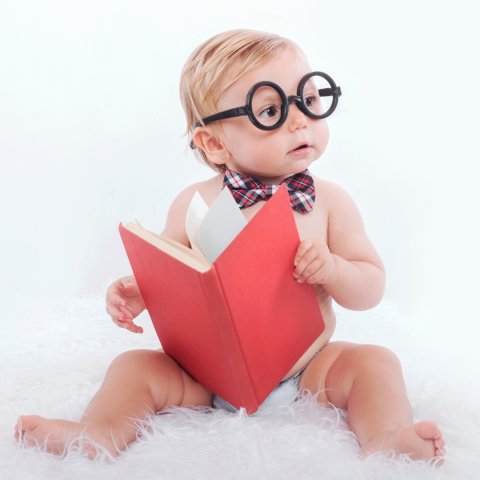 Baby holding a book