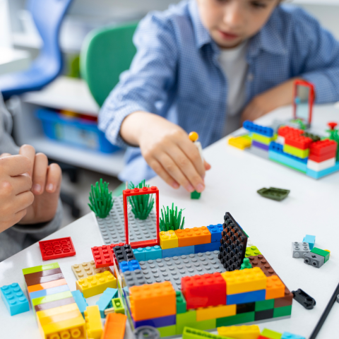 Child playing with LEGOs