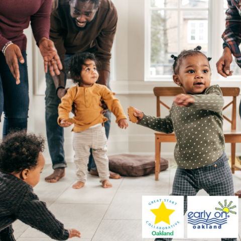 Three small children dancing and playing with their 3 adult caregivers.