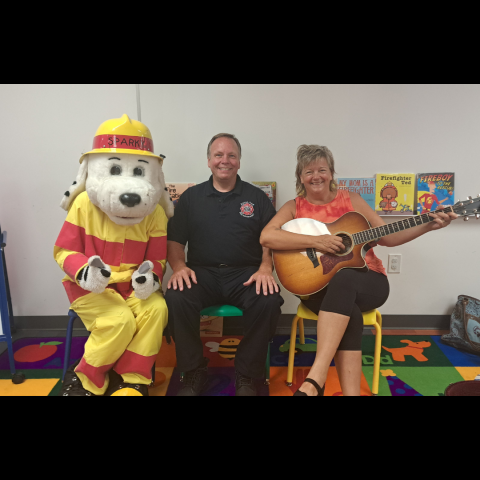 Sparky the dog, Cary the firemen and Paula with a guitar