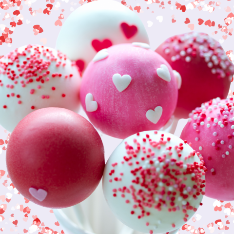 pink and white cake pops with heart sprinkles and nonpareils on a pink background with red hearts