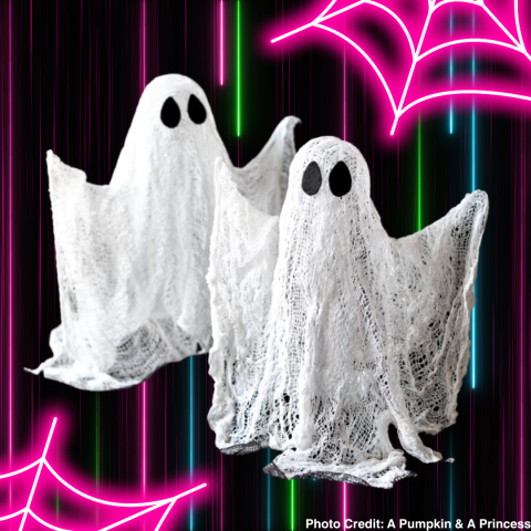 two white cheescloth ghosts with a back background with neon stripes and pink neon spiderwebs in the corner
