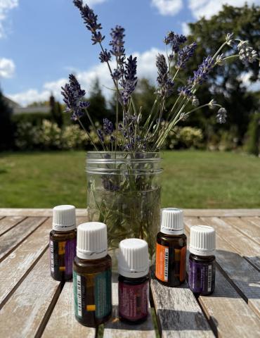 Essential Oils On A Table Outdoors