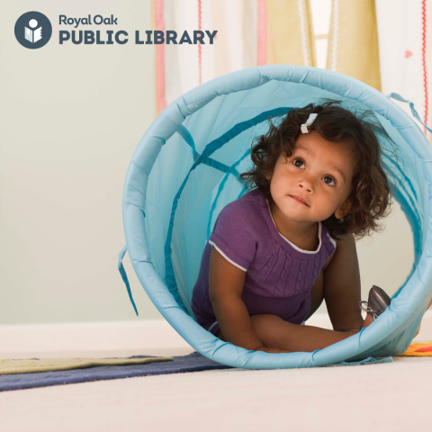 Little girl in a teal tunnel 