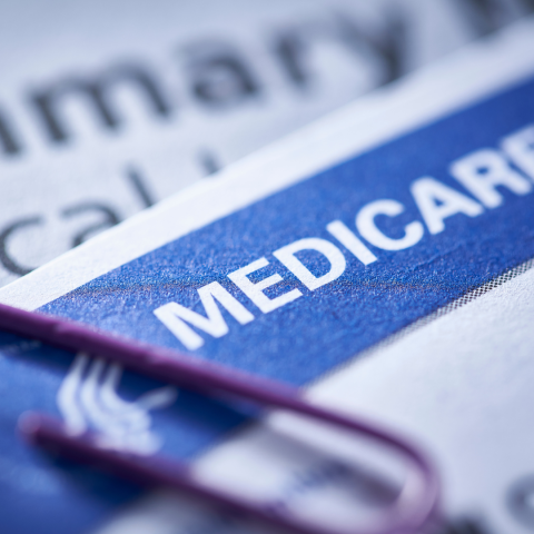 Medicare Card With Red Paper Clip